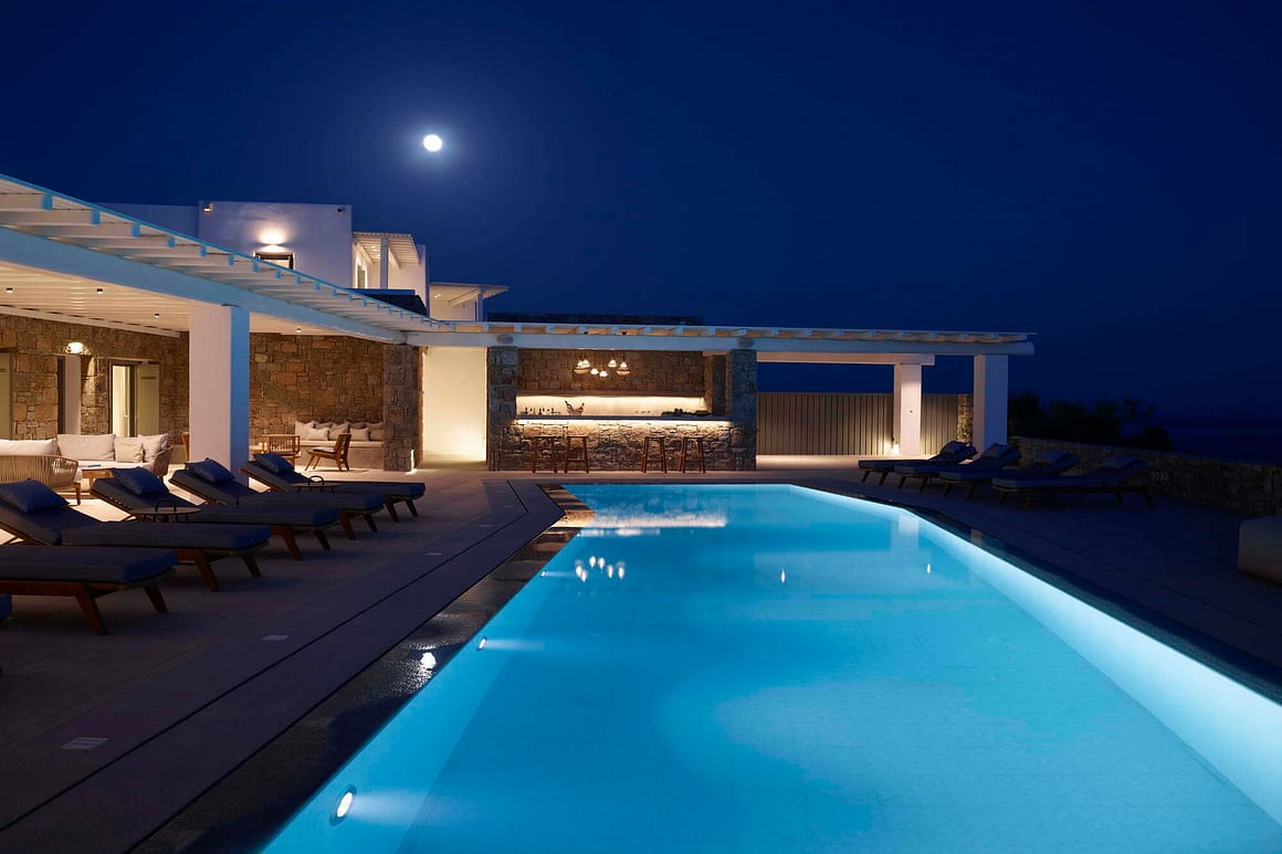 blue pearl outdoor area by night - billionaire club mykonos villas concierge