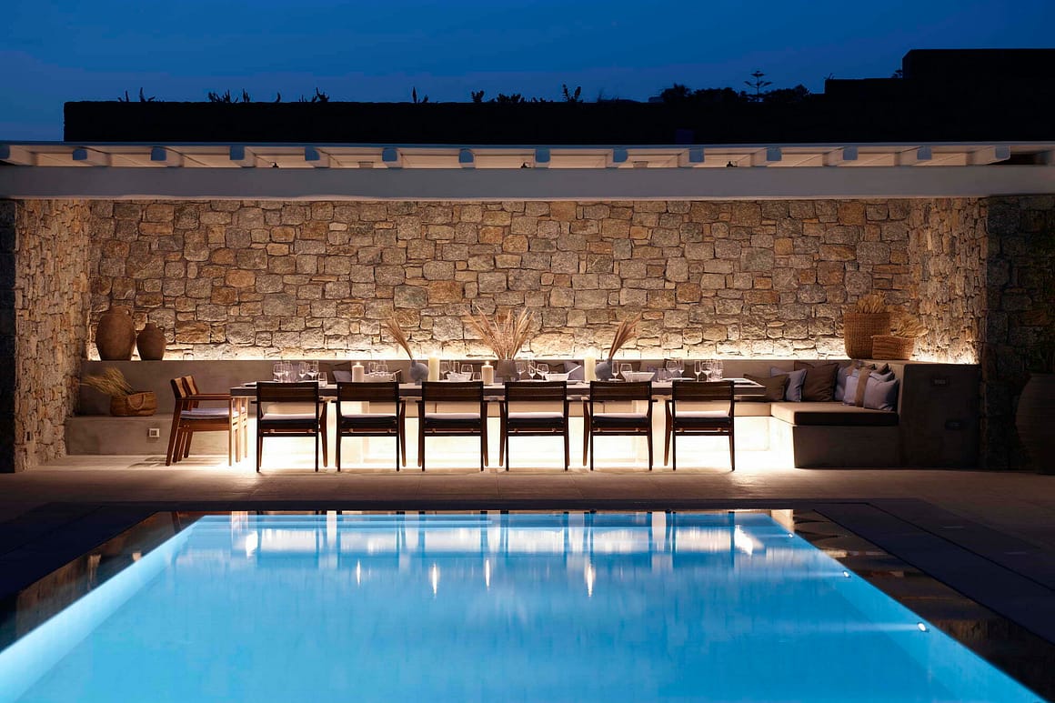 blue pearl outdoor area by night - billionaire club mykonos villas concierge pool