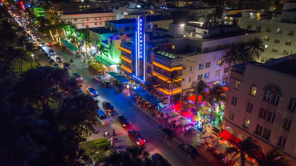 Aerial view of a neon-lit street at night