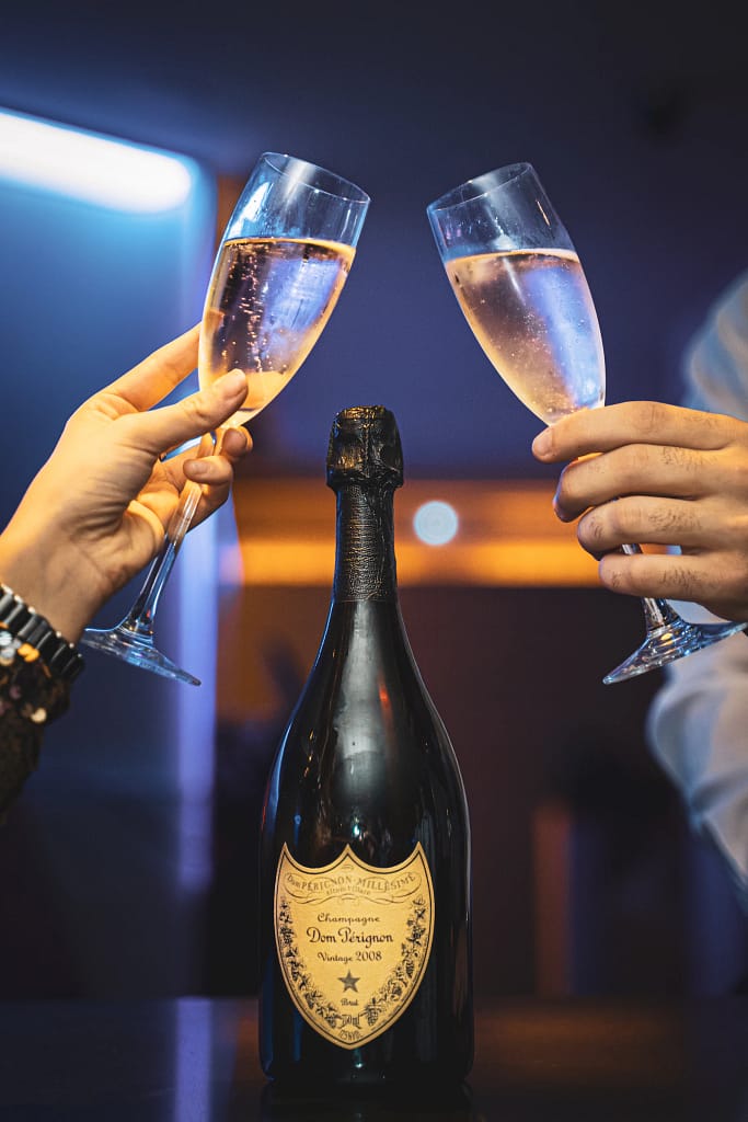 Champagne toast with bottle service at a VIP table